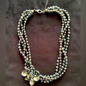 Necklaces, silver and blue finish with a metal silver flower that sits on side